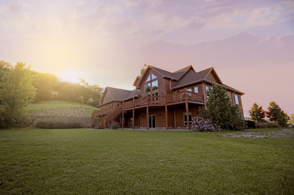 Large estate-style home exterior with a complex roofline near Milton